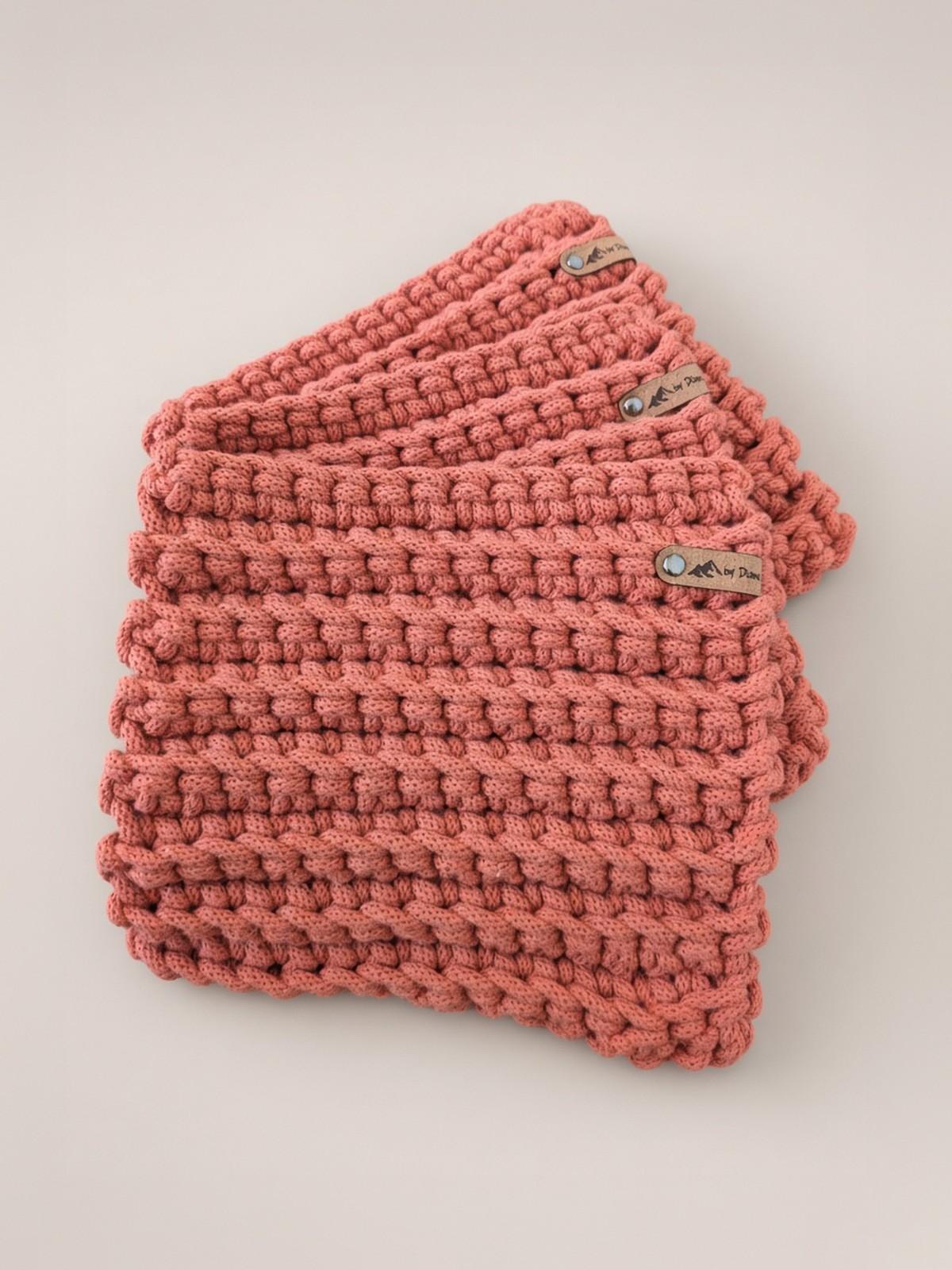Stack of terracotta handmade crochet hot pads